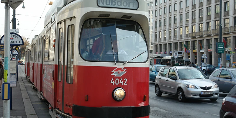 Ringstrasse with a passing tram and a grand historicist building