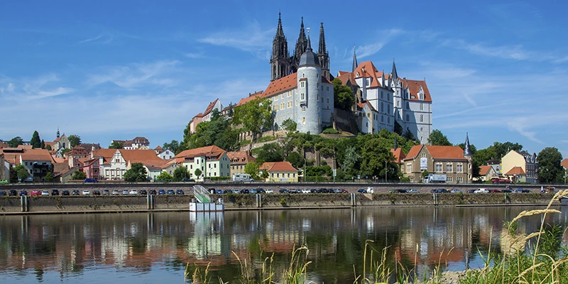 The Albrechtsburg and cathedral above Meissen reflected in the Elbe in summer