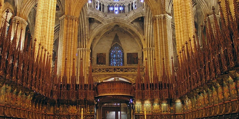 Barcelona Cathedral facade illuminated at night with Gothic architectural details