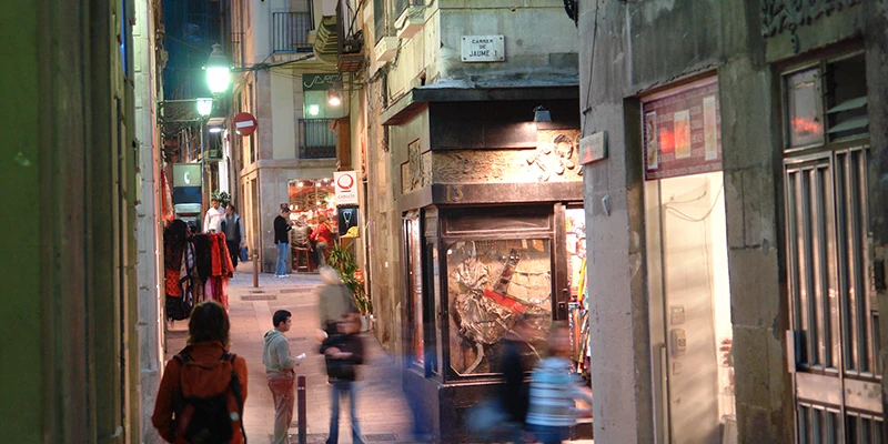 Carrer Freneria, a busy pedestrian lane in the Gothic Quarter with shops