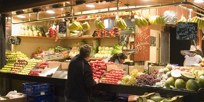 Fresh fruit and vegetable stalls inside Mercat de la Boqueria