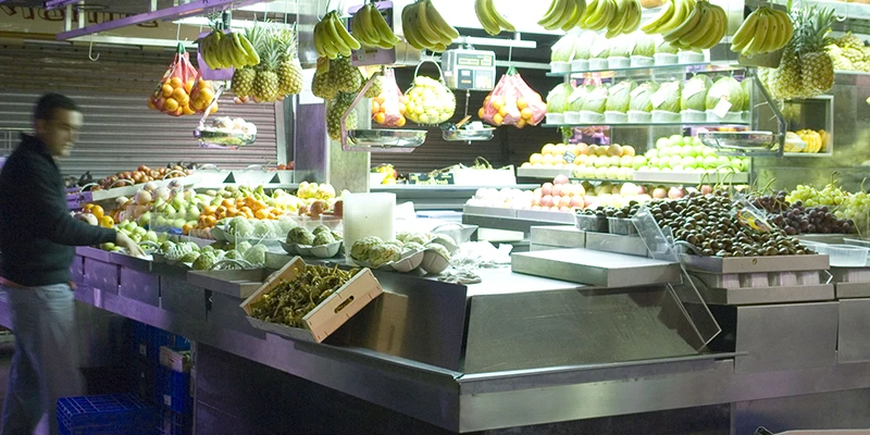 Food counter serving fresh meals at Boqueria market