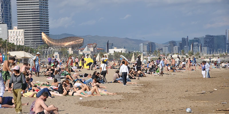 Crowds enjoying Barceloneta beach in summer