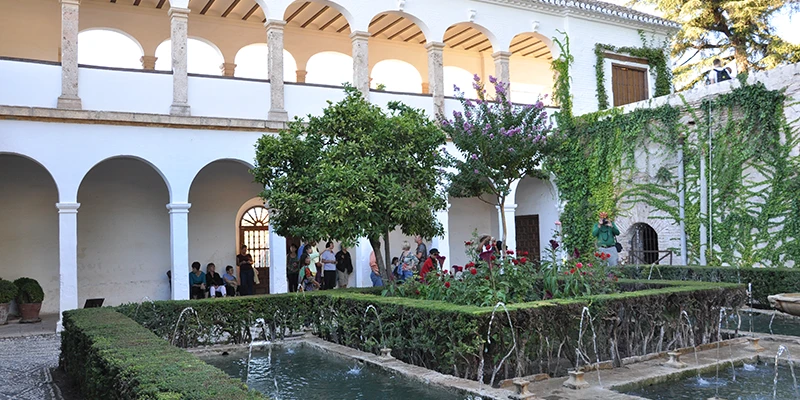 Visitors inside the Alhambra Nasrid Palaces